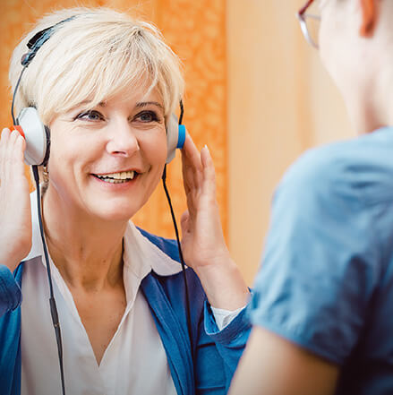woman taking hearing test