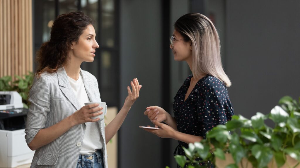 A hospital marketer and past patient discuss and record the patient’s story for a testimonial.