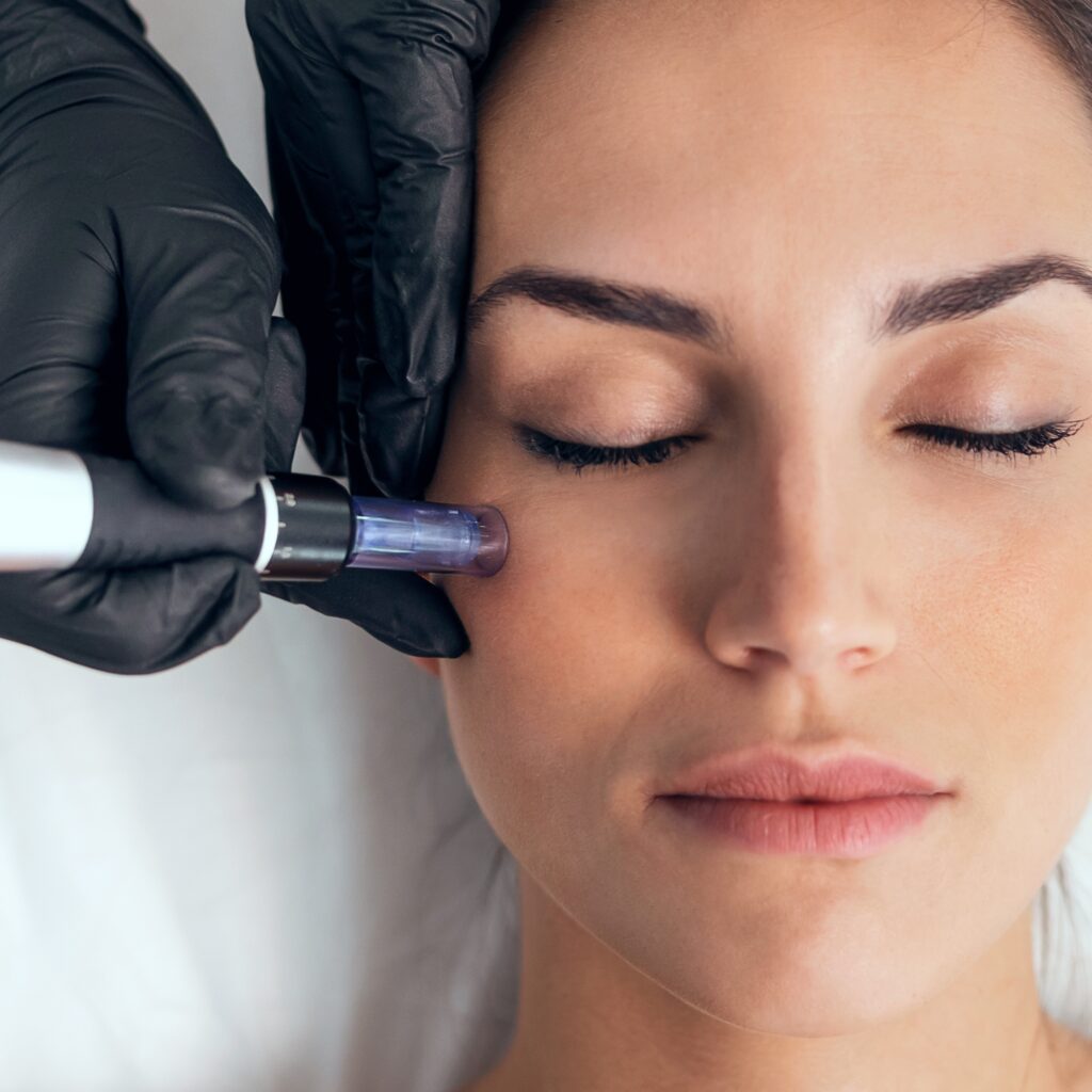 Shot of cosmetologist making mesotherapy injection with dermapen on face for rejuvenation on the spa center.